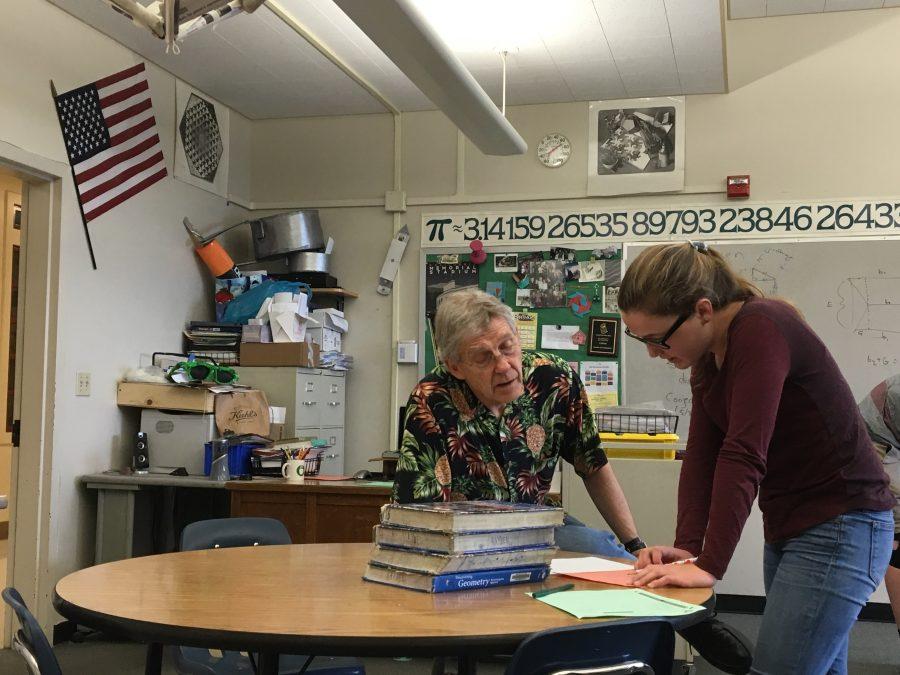 Marthinsen helps a student with a math assignment during tutorial. Marthinsen will conclude his twenty year tenure with PHS this year. 