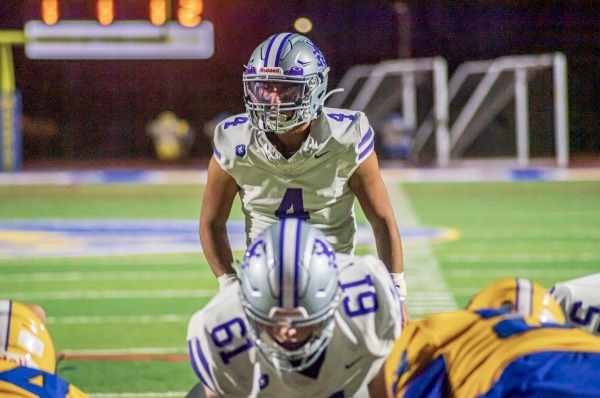 Marcos Lagios (11) prepares to take a snap