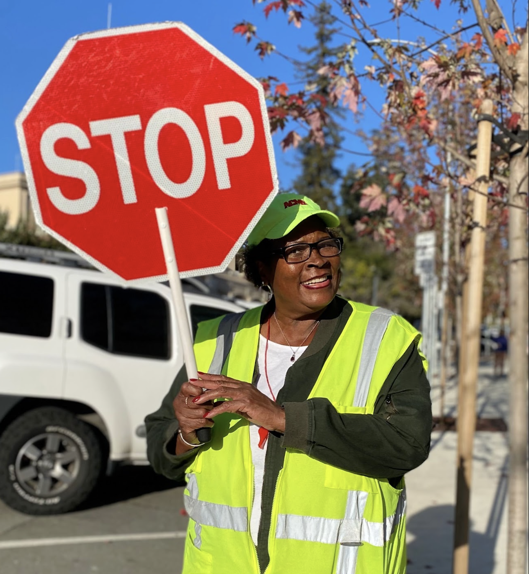 Valerie Jones holds up her stop sign.