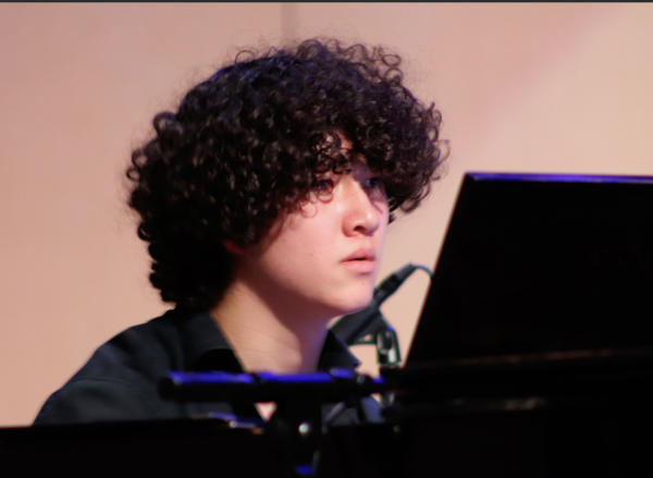 Logan Watral (11) plays piano