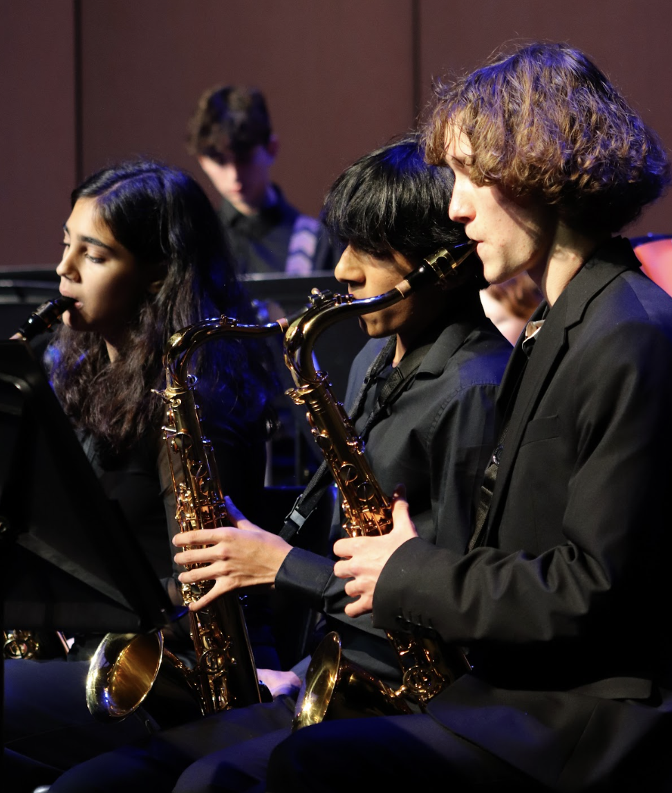 Members of the band play saxophone