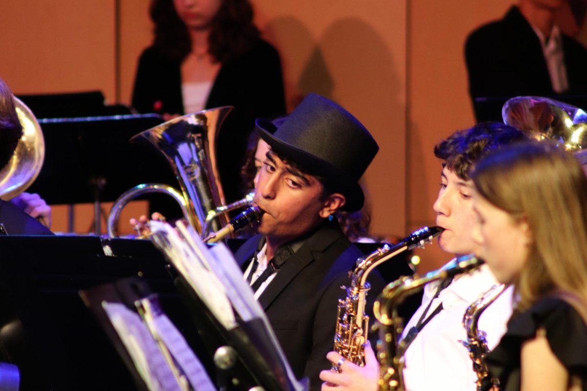 Zayd Mahmood (9) on alto saxophone during the Pep Band performance on December 12.