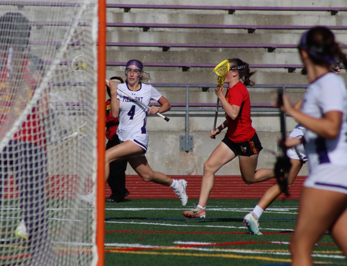 Senior Louisa Cole rounds the goal to take a shot during the WACC Semi-Finals against Berkeley.