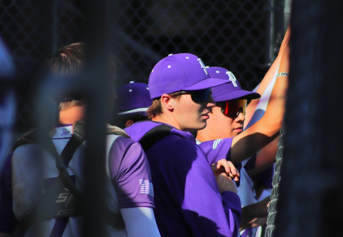 Senior Drake Prata and team members cheer when Piedmont is hitting during a home game on April 30 against Berkeley.