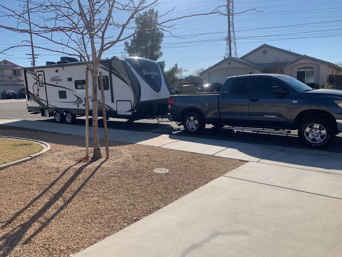 The 100 square feet RV Garcia lived in for four years, from 2020 to 2024. The RV would normally be parked in
an RV park, in the photo the RV is parked outside her Aunt's house. The RV is attatched to her truck that she
would use to take her RV to different places.