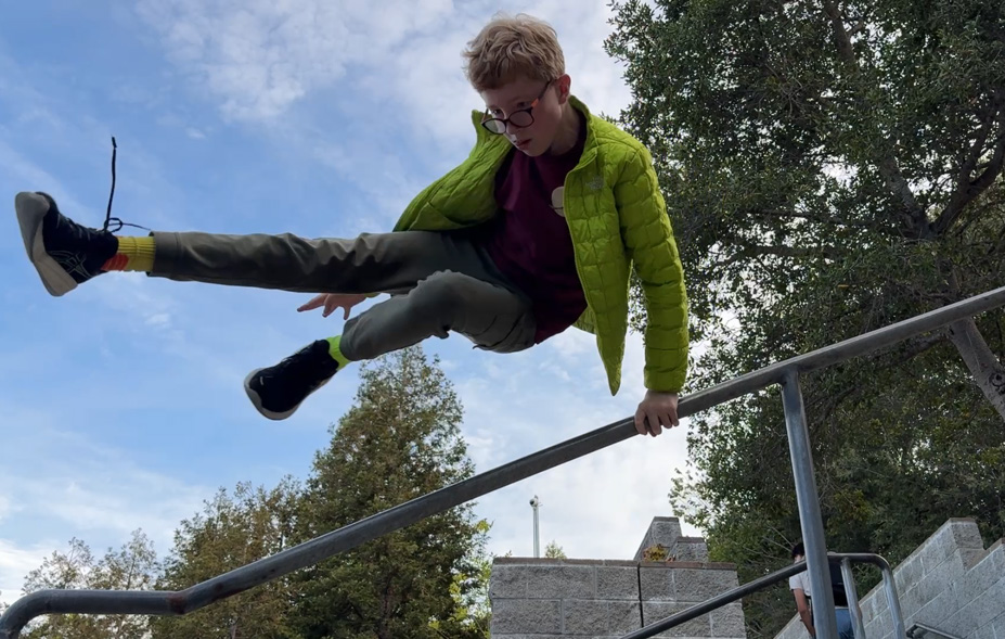 Sophomore Austin White at Witter Field practicing his parkour, a sport that involves dodging obstacles in an urban enviorment by running, jumping, and climbing.
