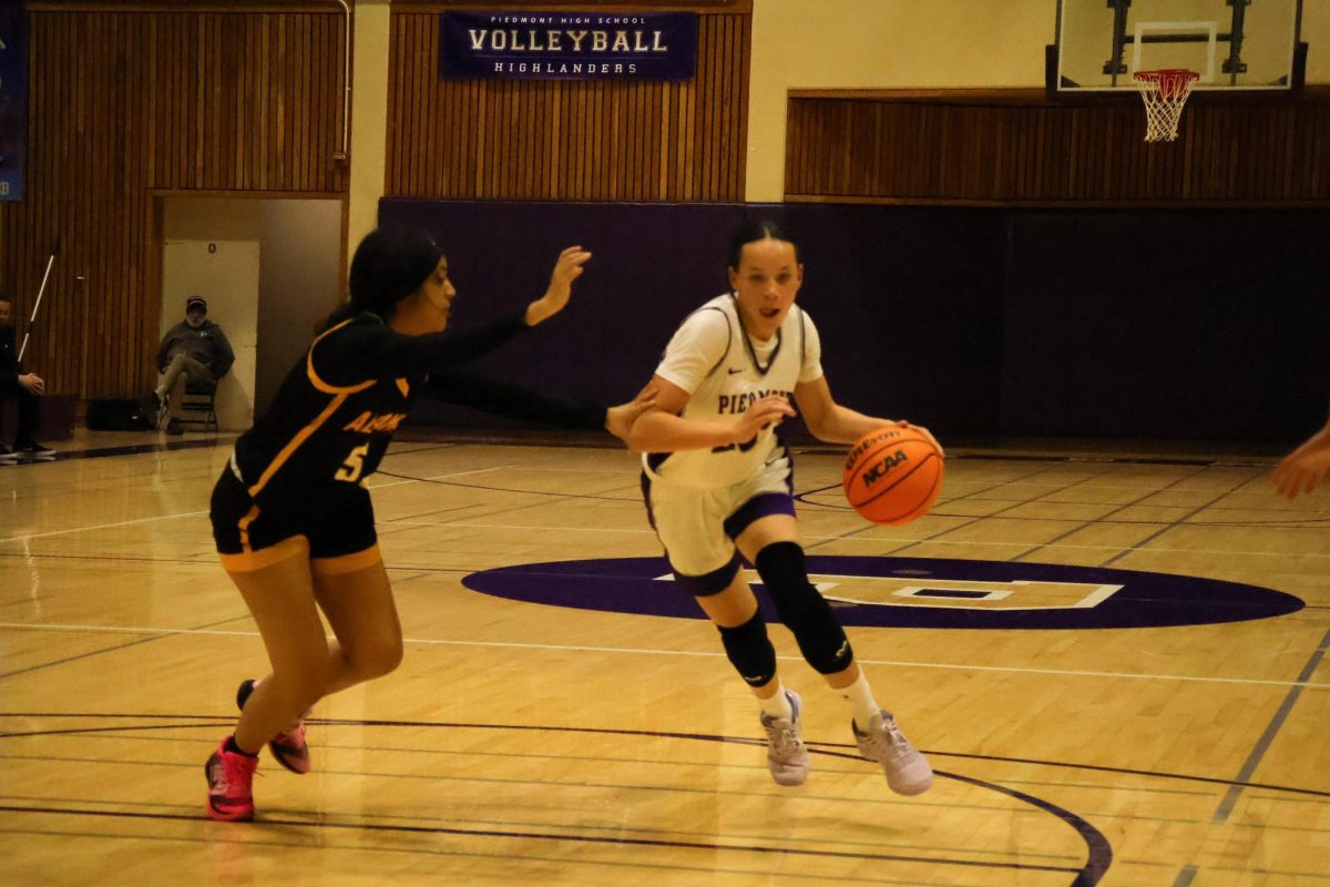 Freshman Alexa Ba charges toward the basketball in victory against Alameda on Jan 24.