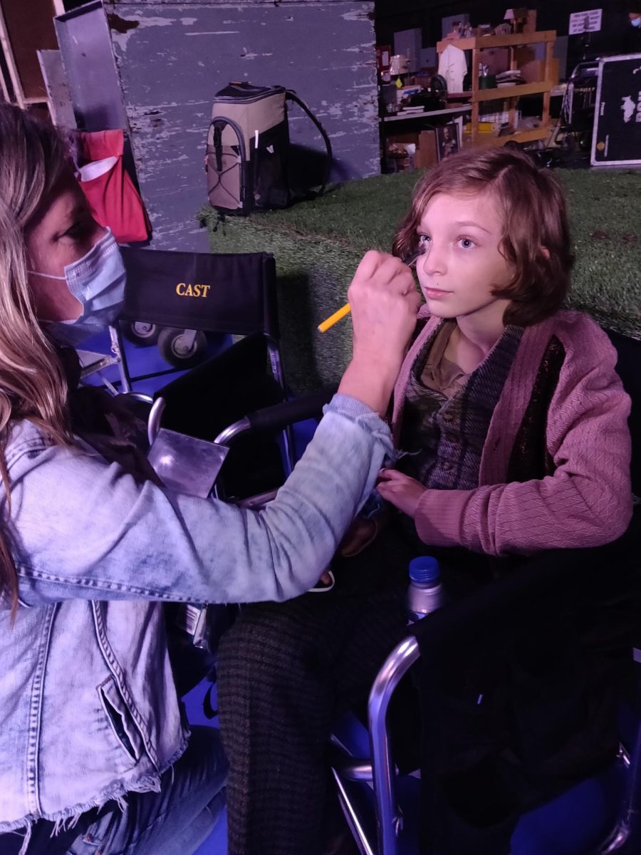 Freshman Danilo Titterton (age 10 in photo) getting makeup touch-ups on the set of the drama thriller TV show Hunters