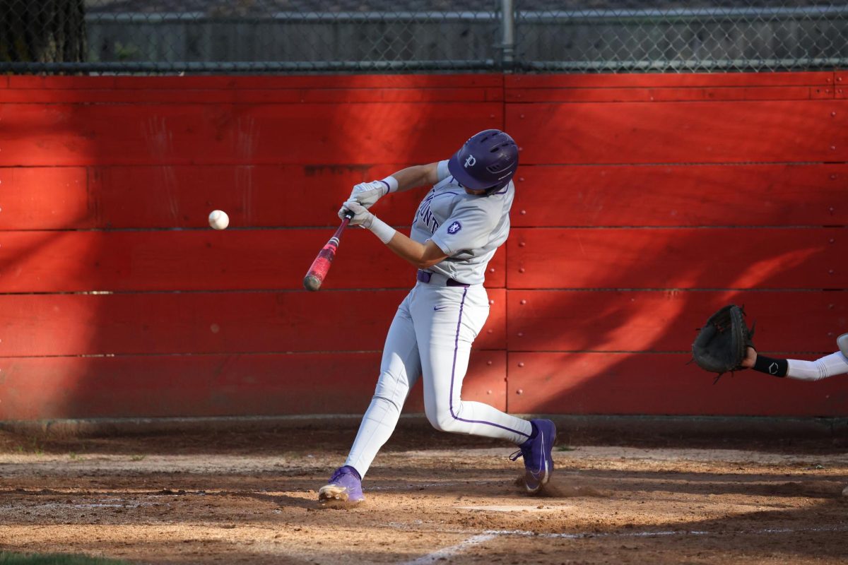 Co-captain shortstop senior Diego Delventhal hit a pitch against Skyline on Feb. 27. Piedmont won 10-1.