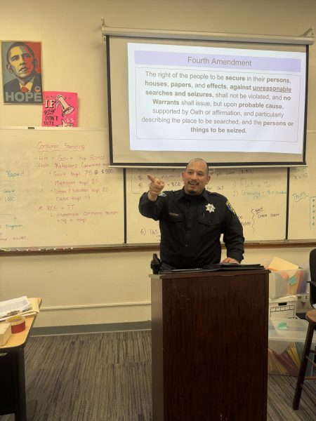 Officer Hugo Diaz presenting in the classroom.